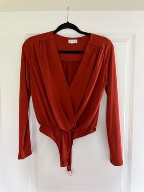 Vestique Burnt Orange Long Sleeve Bodysuit